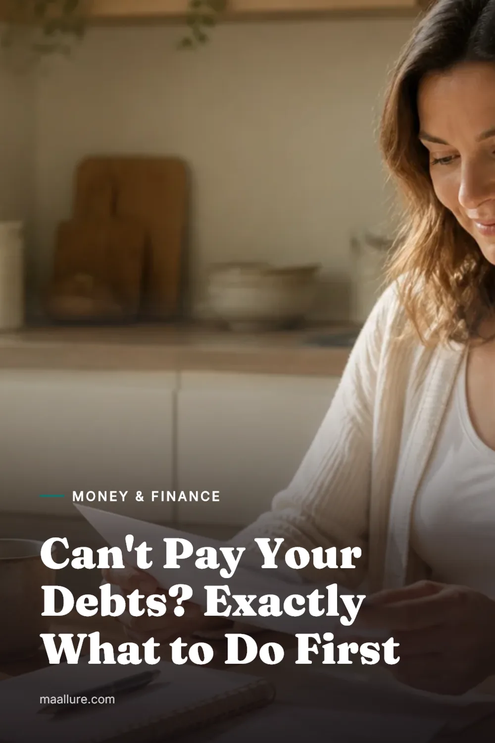 Woman at a sunny kitchen table calmly sorting opened letters next to a notebook, laptop and cup of tea while making a plan for her bills
