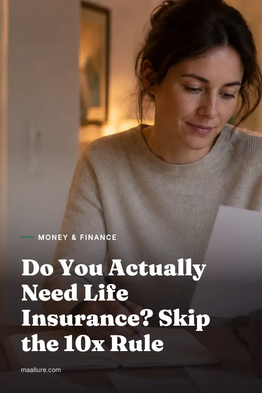 Woman at a kitchen table in the evening reviewing household paperwork and notes while planning her family's life insurance
