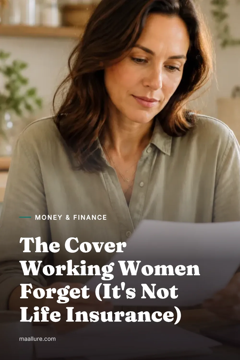 Woman at a sunlit kitchen table reviewing insurance paperwork beside a laptop and a cup of tea