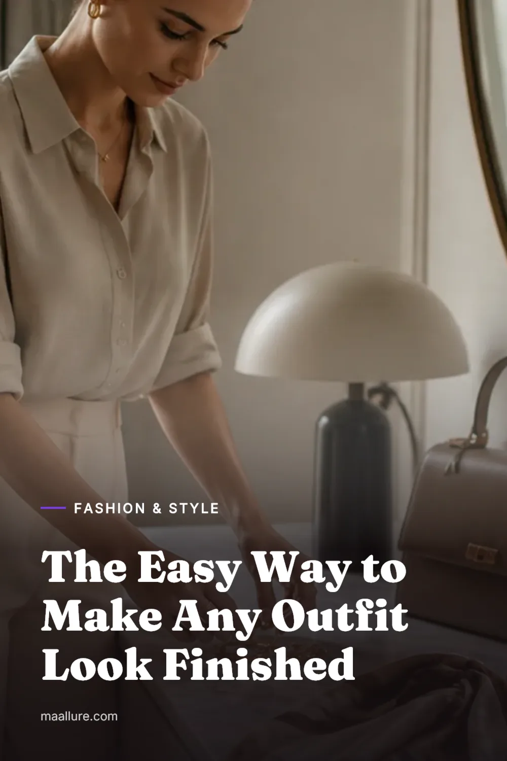Jewellery, silk scarf, leather belt and structured handbag arranged beside a neutral outfit