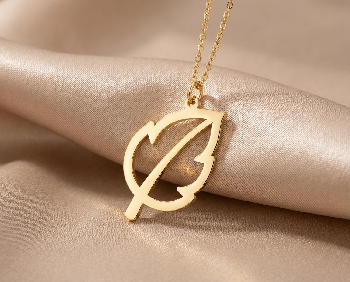 Leaf Necklace: Gold Tone Pendant With Delicate Design