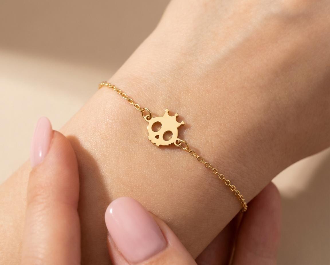 Cute Skull Bracelet: Gold Finish Crown Detail