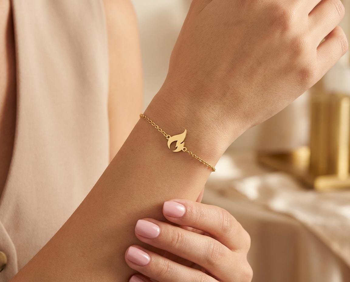 Flame Bracelet: Gold Finished Fire Symbol Design